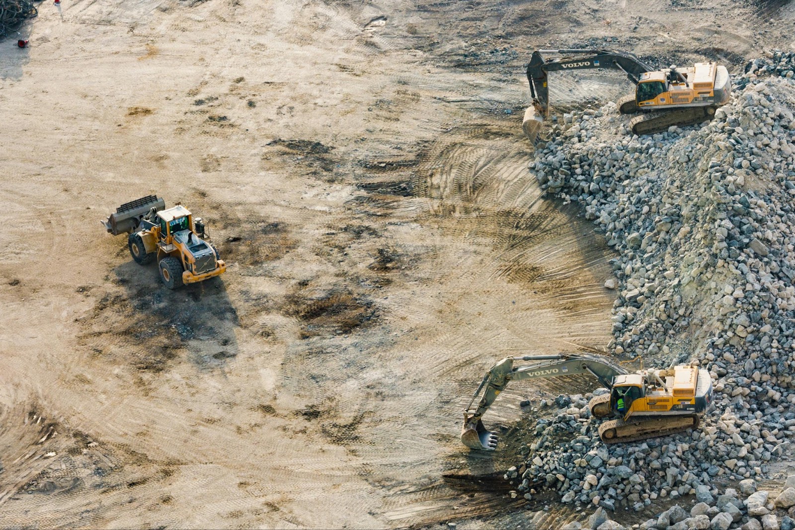 A construction surveyor measuring and mapping land to set out building positions and legal boundaries