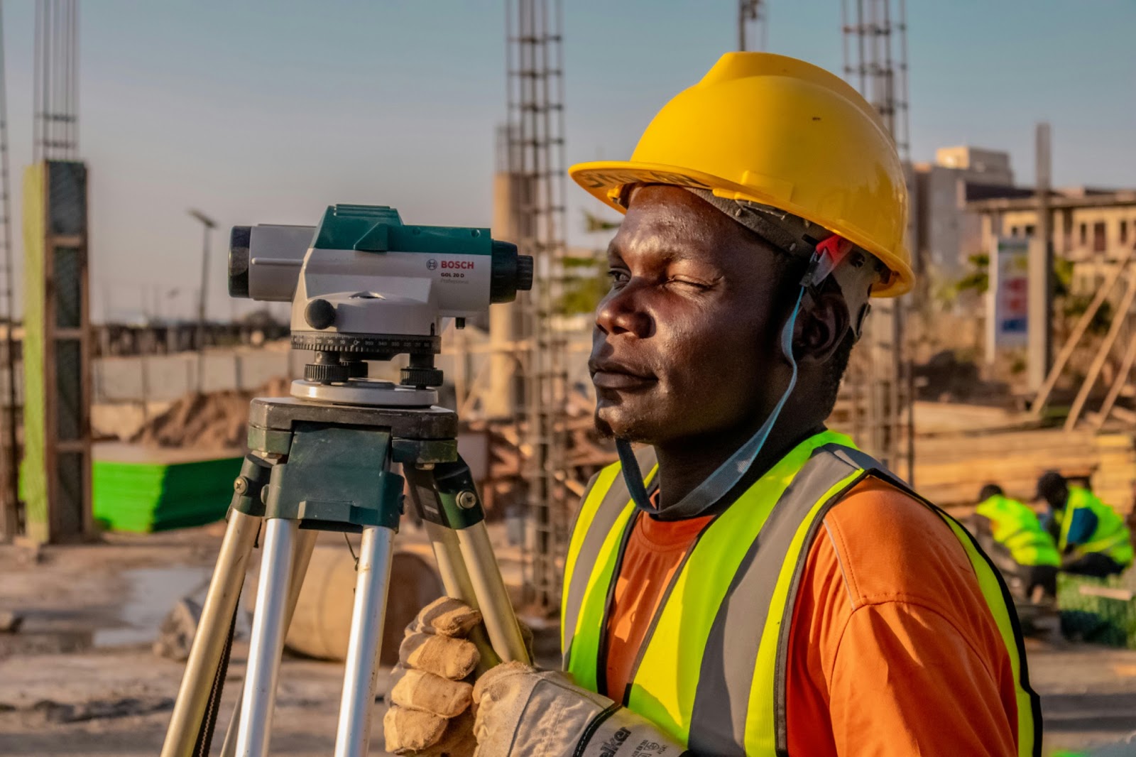 A construction surveyor carrying out a site inspection and progress check during a construction project