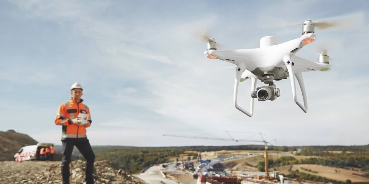 A RICS-accredited surveyor using a drone to capture construction survey data faster and more accurately